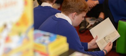 Boy reading classroom
