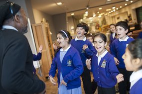School children in uniform looking excited
