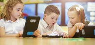 Boy and girl with technology tablet reading