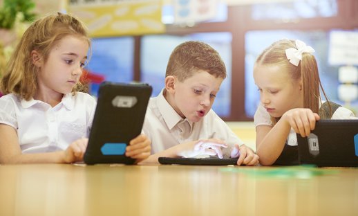Boy and girl with technology tablet reading