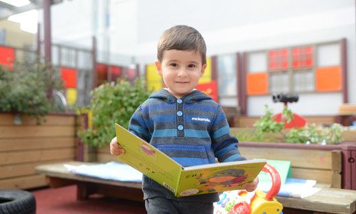 Boy_in_blue_reading.jpg