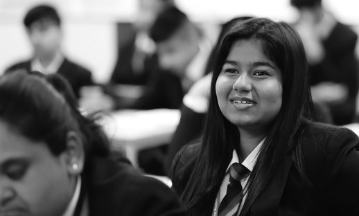 Busy classroom secondary girl greyscale National Literacy Trust