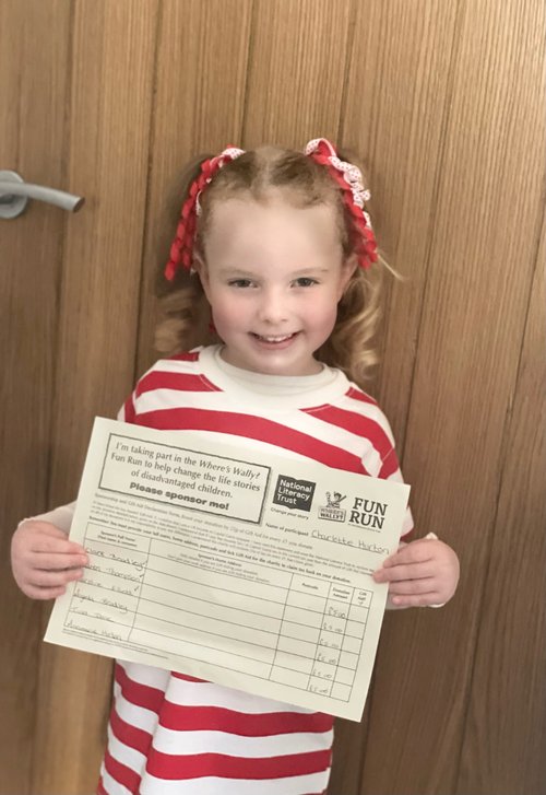 Little girl dressed as Where's Wally?