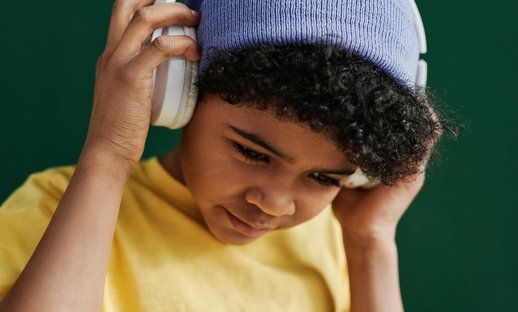 Child in hat and headphones