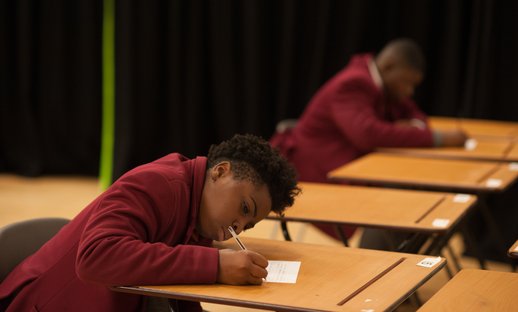 Secondary pupil taking exam