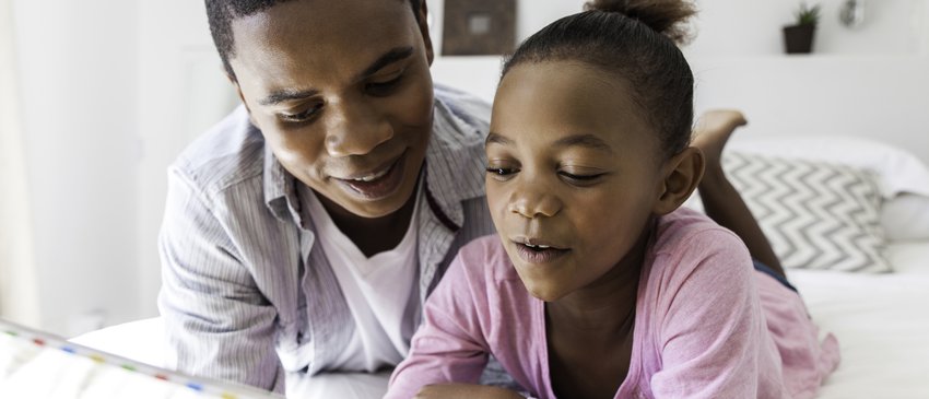 Dad and daughter reading