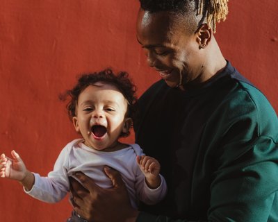 Dad and baby Early Words Matter close up