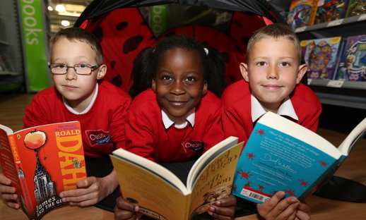 Kids reading in tent.JPG