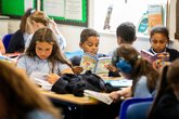 Children read books in school. Drake Circus - Young Readers Programme