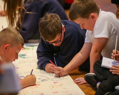Boys (children) in a writing workshop