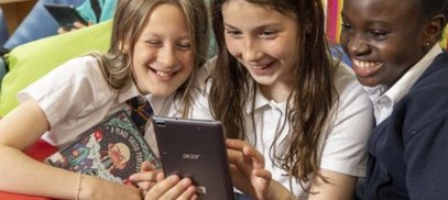 Children reading humorous book