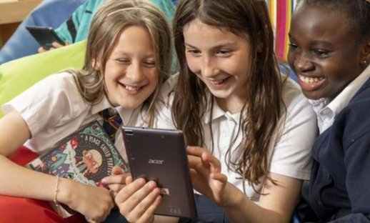 Children reading humorous book