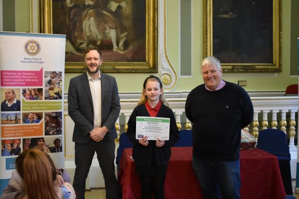 Selena S, Doncaster's Great Green Read Winner 2022, with Doncaster Stories Hub Manager, Phil Sheppard, and Rotary Environmental Lead, Phillip Wilbourn