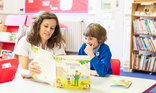 Teacher reading with child.jpg