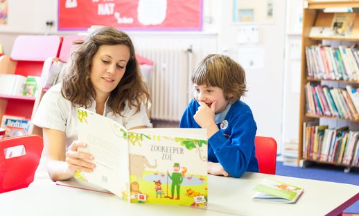 Teacher reading with child.jpg