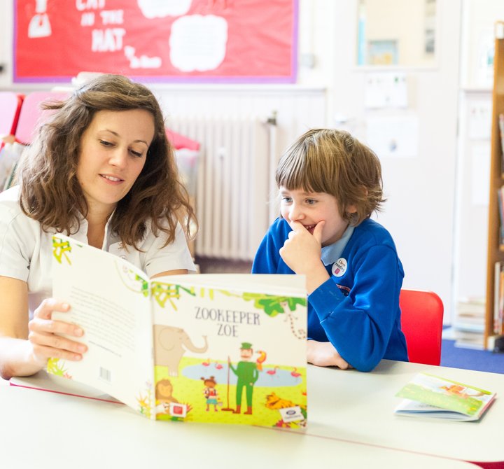 Teacher reading with child.jpg