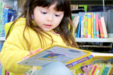 Nottingham child with book in library