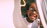 Young child girl big smile close up face early years_National Literacy Trust