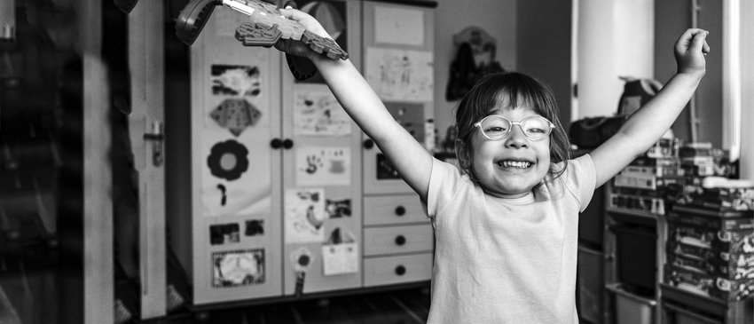 Young girl on her own looking happy