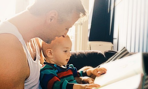 Dad sharing book with child attachment theory