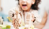 girls with wooden toys.jpg