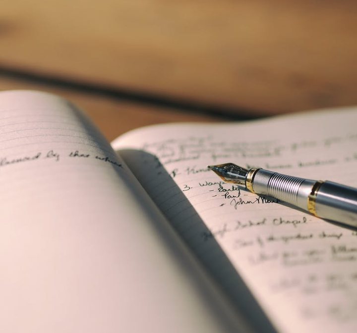 Secondary school pupil writing pen