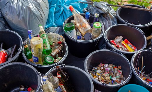 Buckets filled with different types of recycling