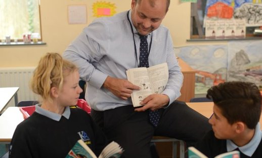 Teacher with student and book