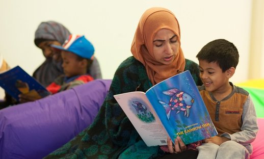 two boys reading with mums.jpg